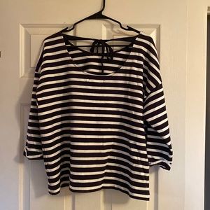 Super cute striped sweater with bow in the back.